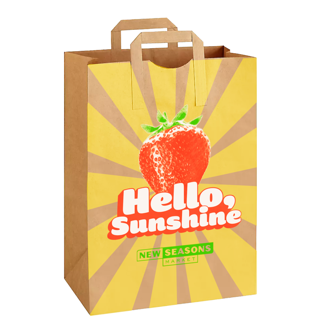 New Seasons paper shopping bag with strawberry and sunbursts for the 