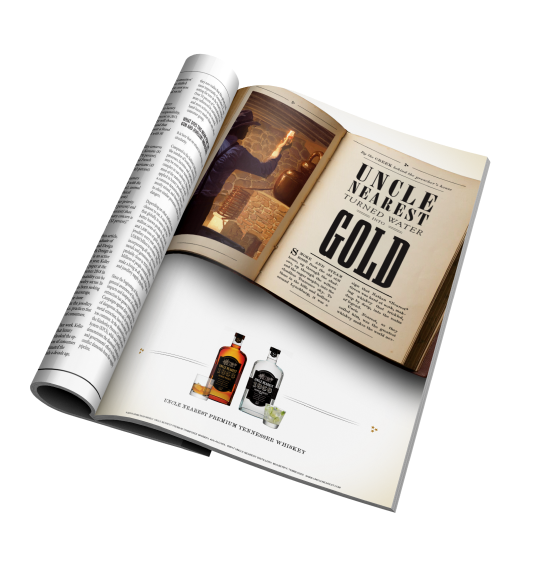 Uncle Nearest Print Ad that shows an antique book opened to a page that has a painting of Nathan Nearest Green from behind as he examine the color of the whiskey in a glass as he stand in front of a copper whiskey still. The other page of the book reads 
